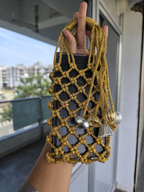 Golden Macrame Mobile Sling Bag with Shimmering Potli Tassels and Festive Zari Dori Work - bridal handbag